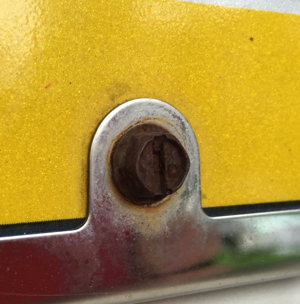 How do I remove rusted license plate screws?